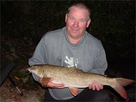 Mike Berridge with a Barbel caught on a Peregrine GTI Rod
